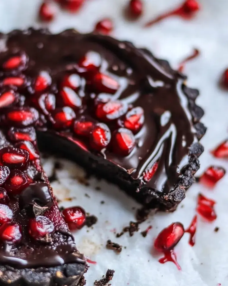 Tasty Dark Chocolate Fudge Pomegranate Tart. photo