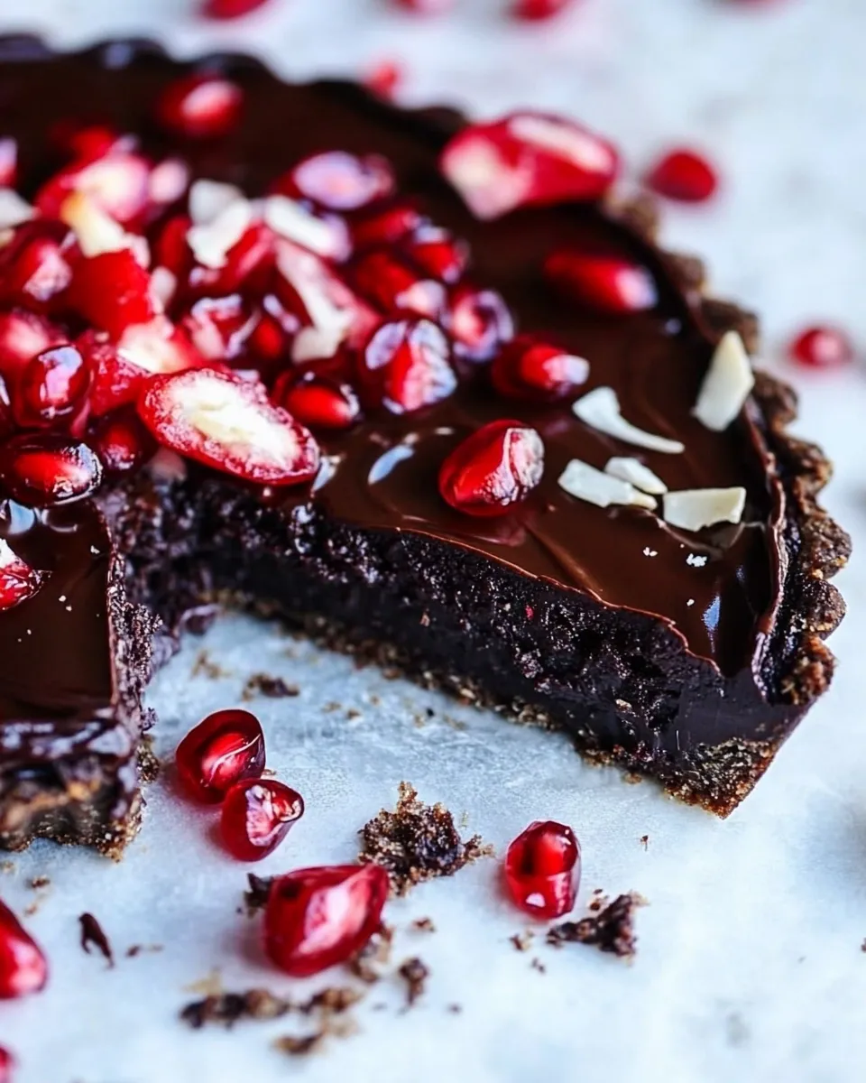Tasty Dark Chocolate Fudge Pomegranate Tart. food shot